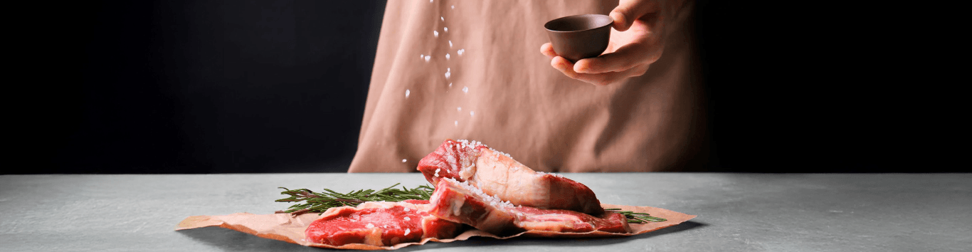 person salt meat